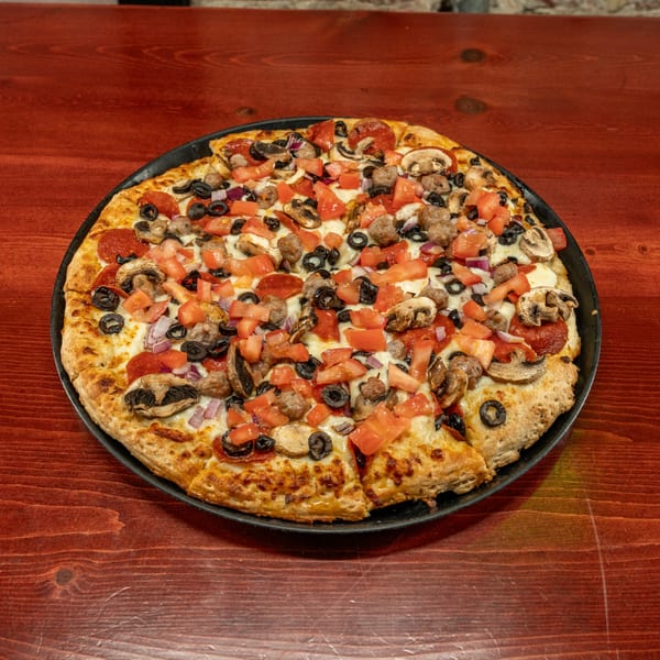 A Corsaro's Family Pizza with pepperoni, sausage, mushrooms, olives, onions, and tomatoes.